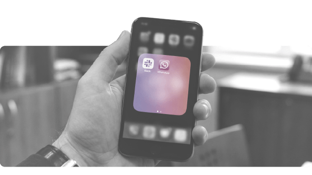 Phone screen with Slack and Whatsapp